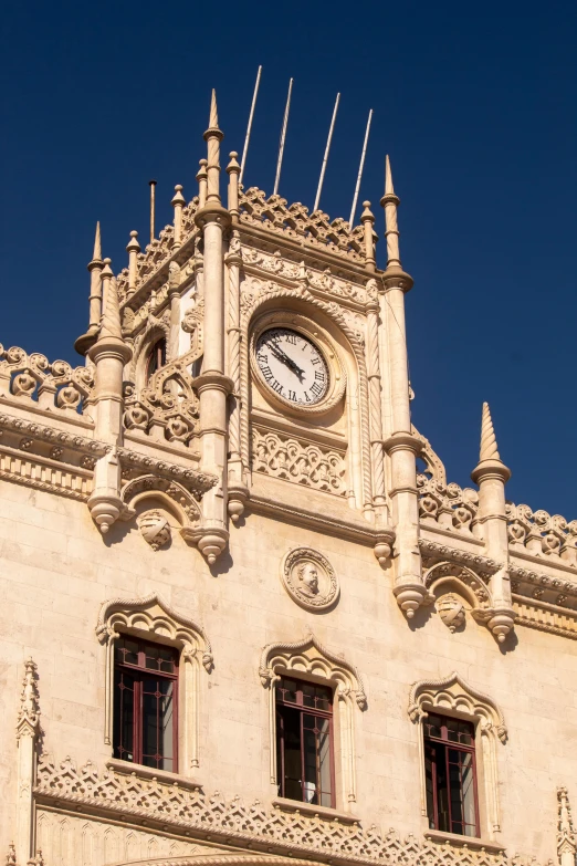 a very tall building with a clock displayed on the front