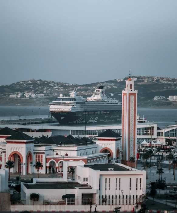 several large cruise ships parked at the dock