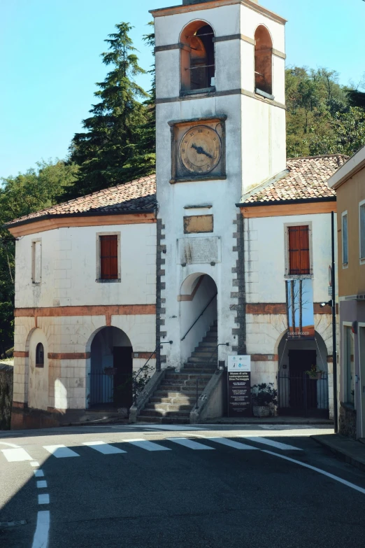 the clock tower is on the side of the building