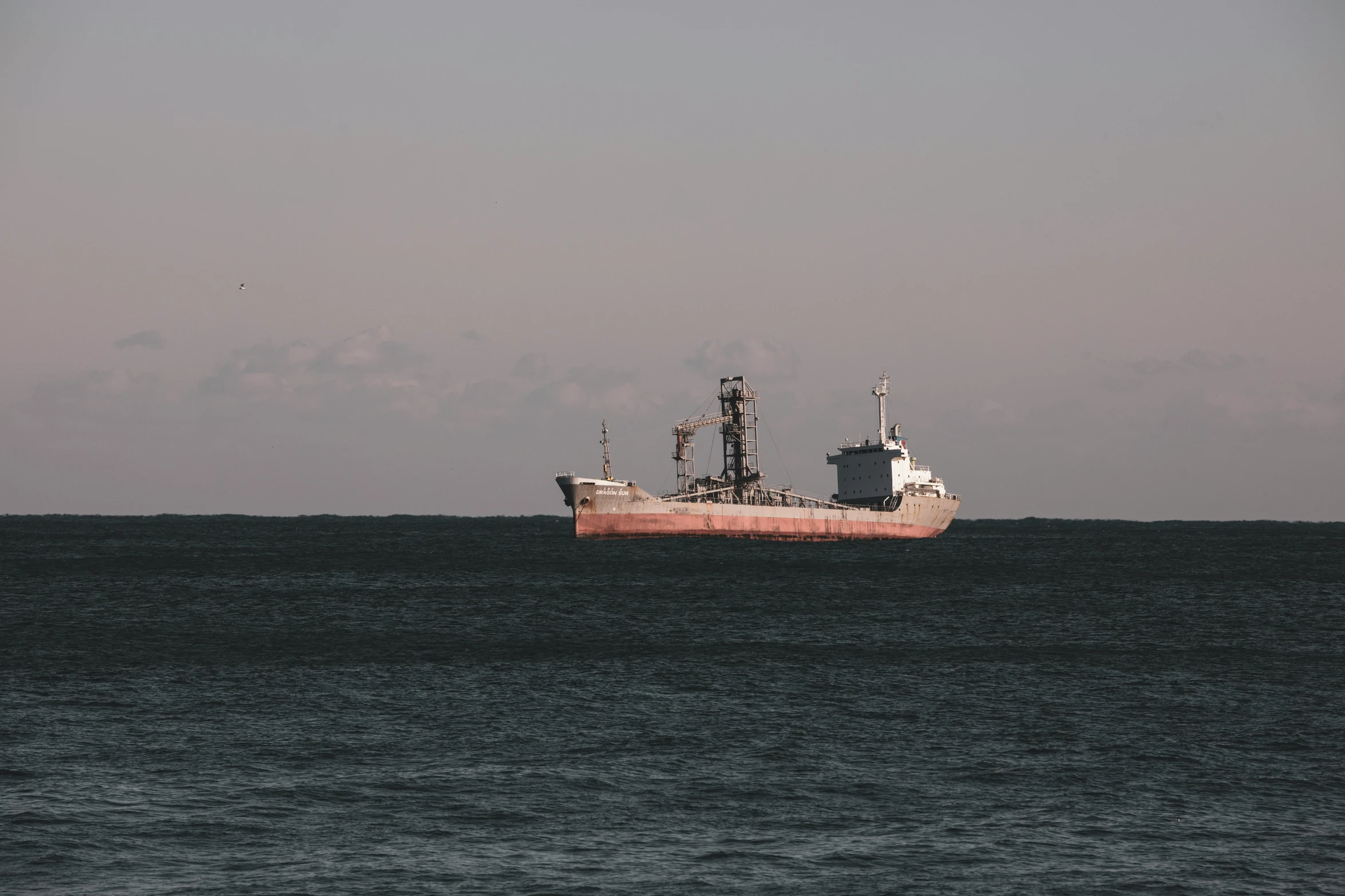 a boat in the water near the coast