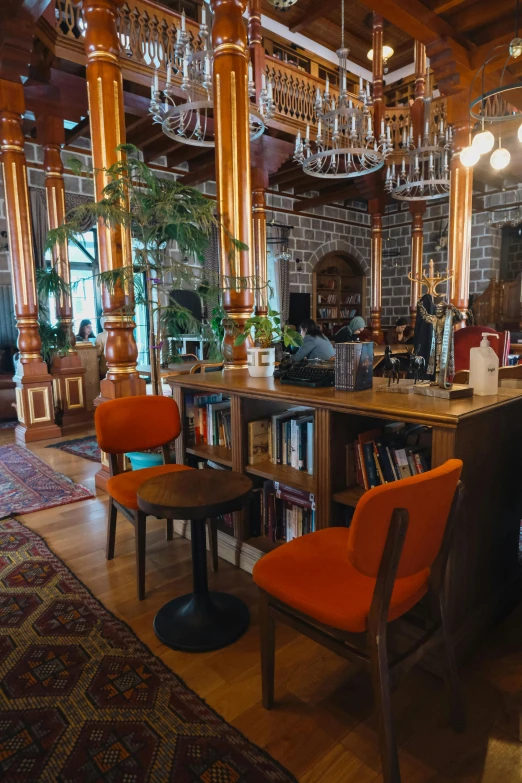 the interior of a restaurant with a long wooden table