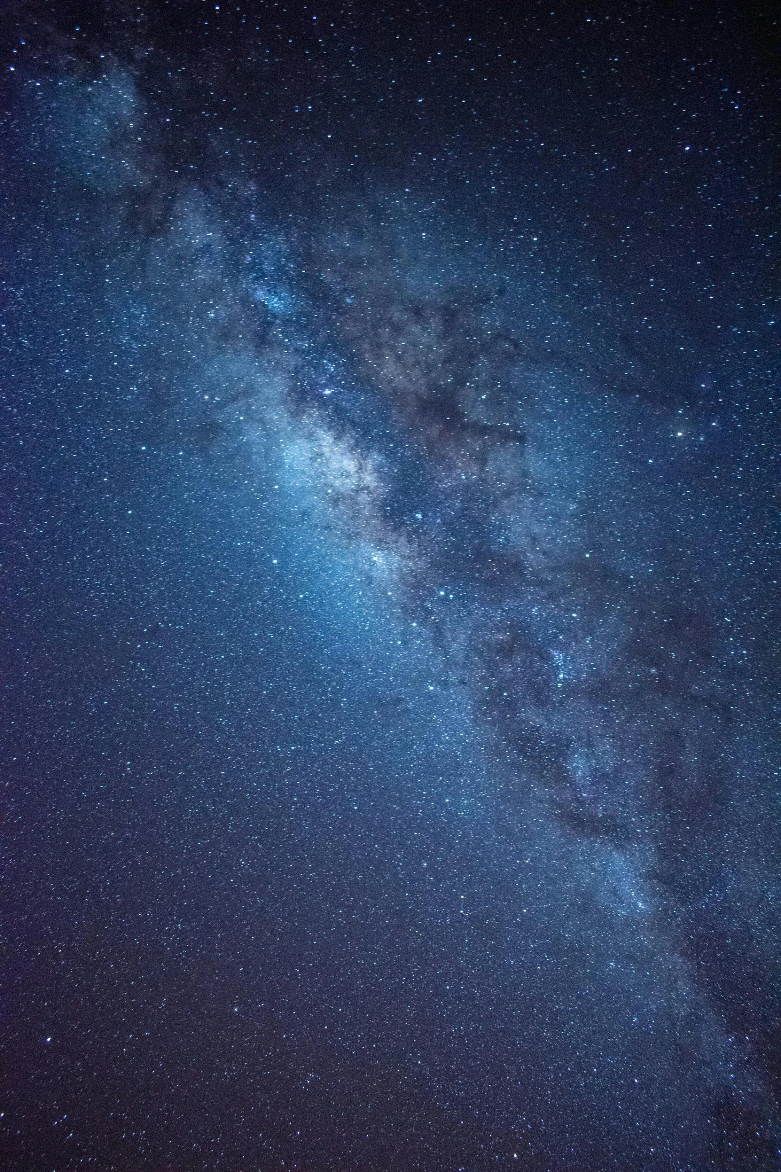 a tall building under a starr filled sky