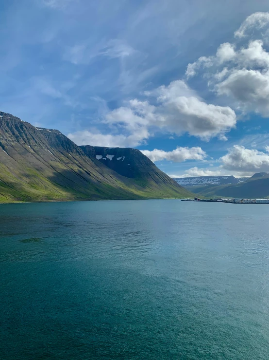 a very pretty looking lake surrounded by some mountains