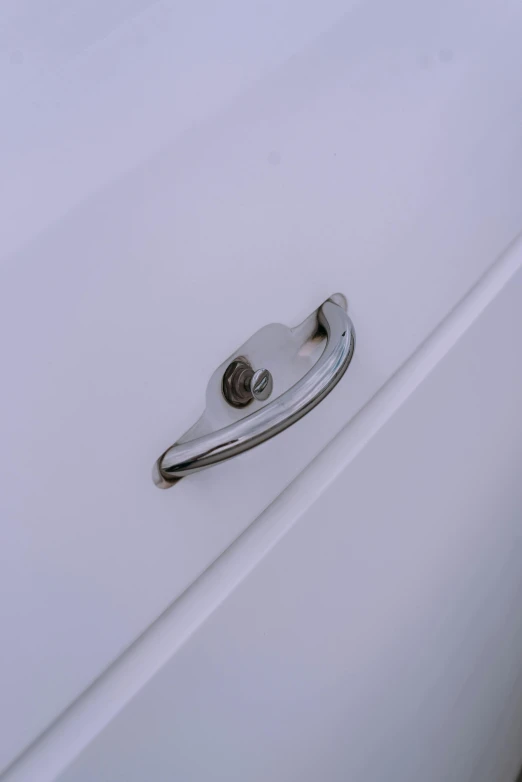 a metal handle on an outside door