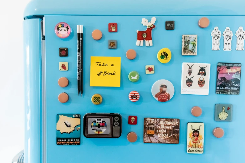 an object is displayed on a bright blue refrigerator