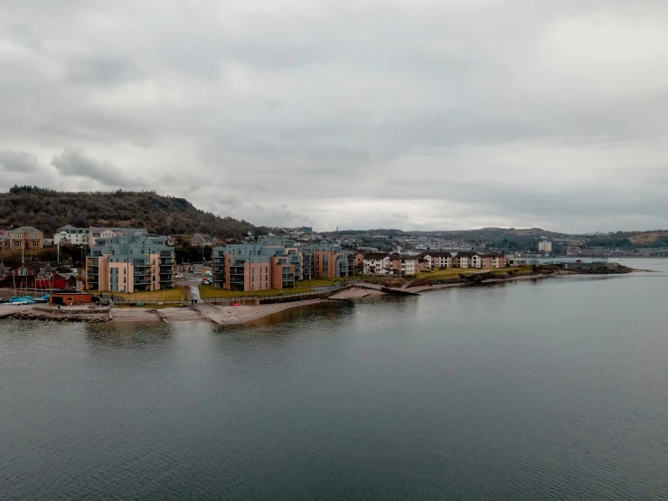 an island in the middle of a lake with buildings