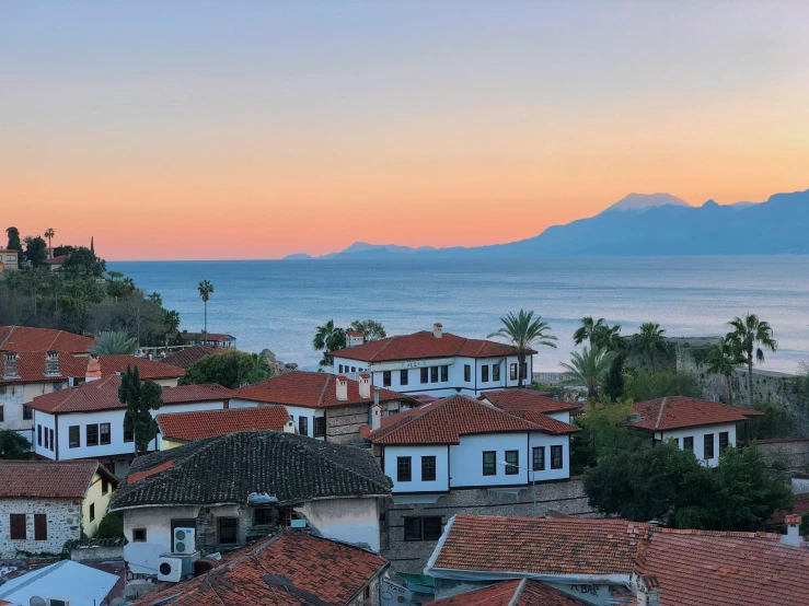 an area with rooftops and a sea view