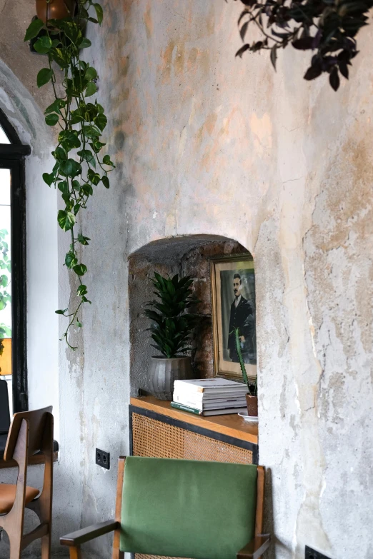 a chair, table and a potted plant in a room