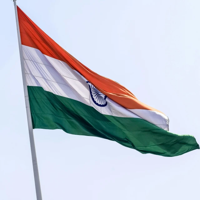 india flag is seen flying at a windy angle