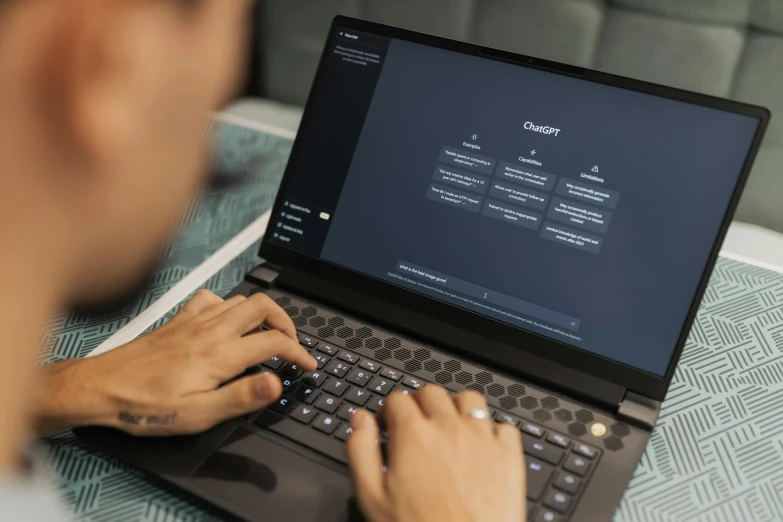 a person working on a laptop in a room