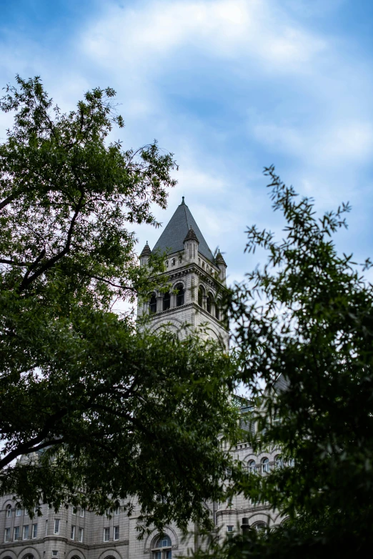 a large tall tower under a partly cloudy sky