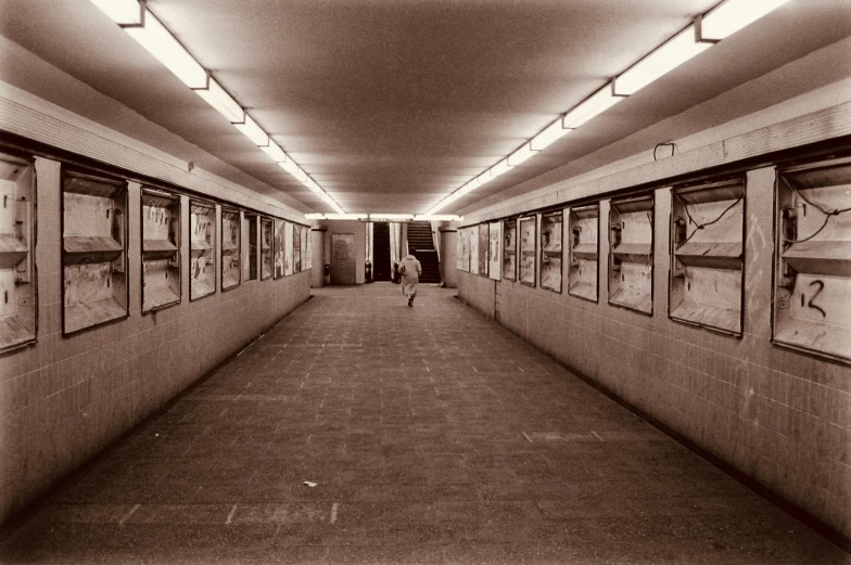 a hallway that has pictures and lights on the wall