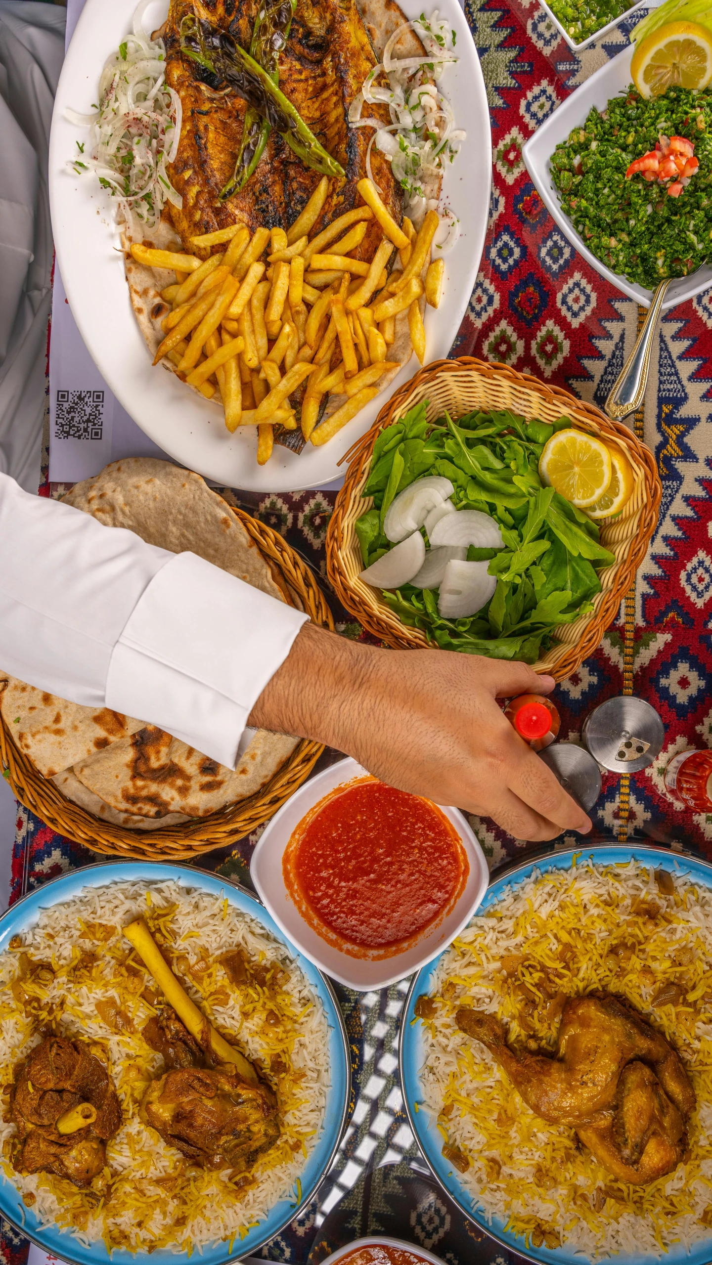 an array of food on a tray and plates laid out