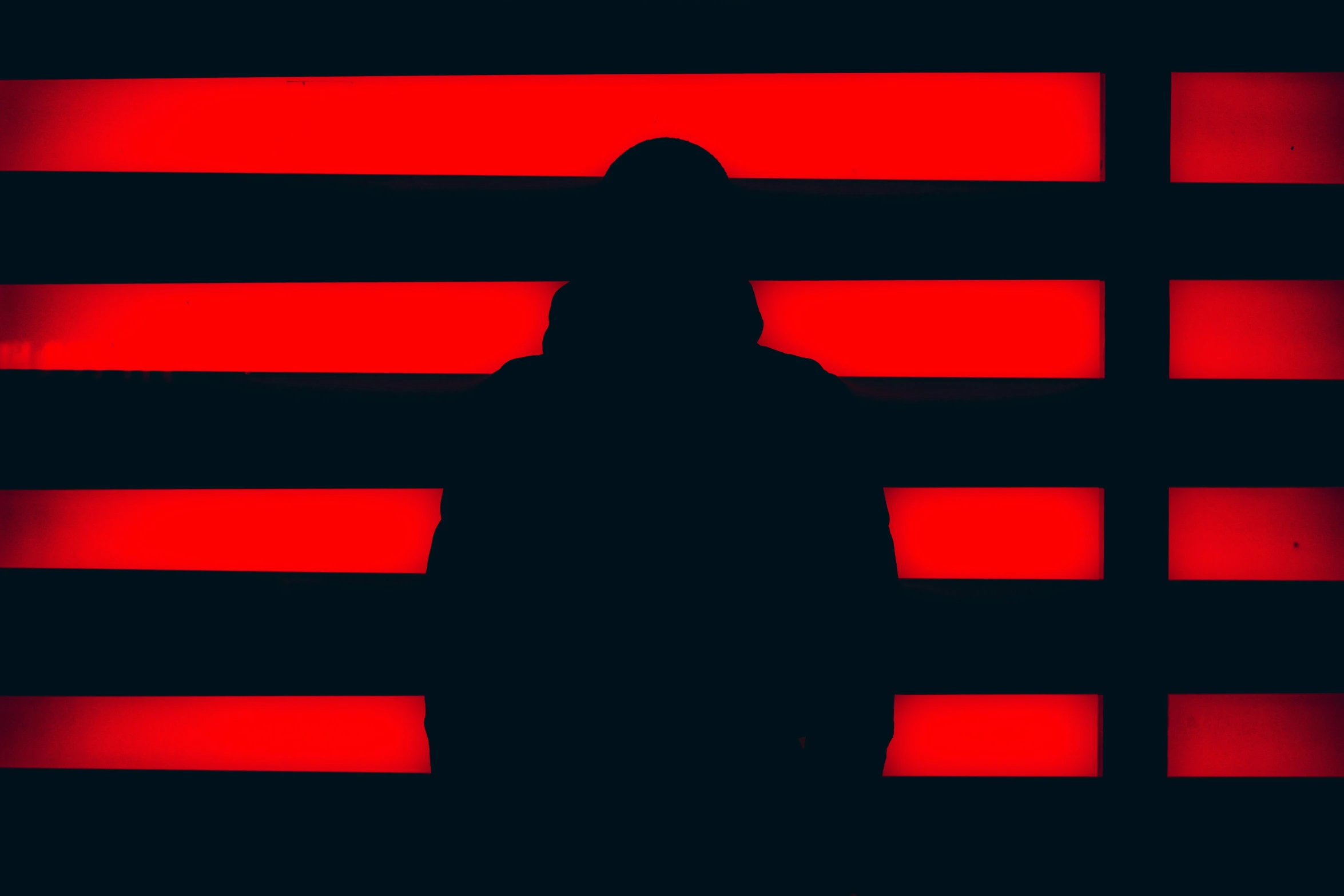 a man standing in front of red strips