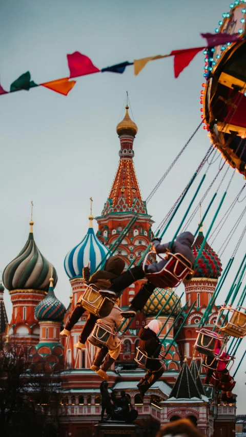 a carousel being watched by a rider and carousel on the other side of it