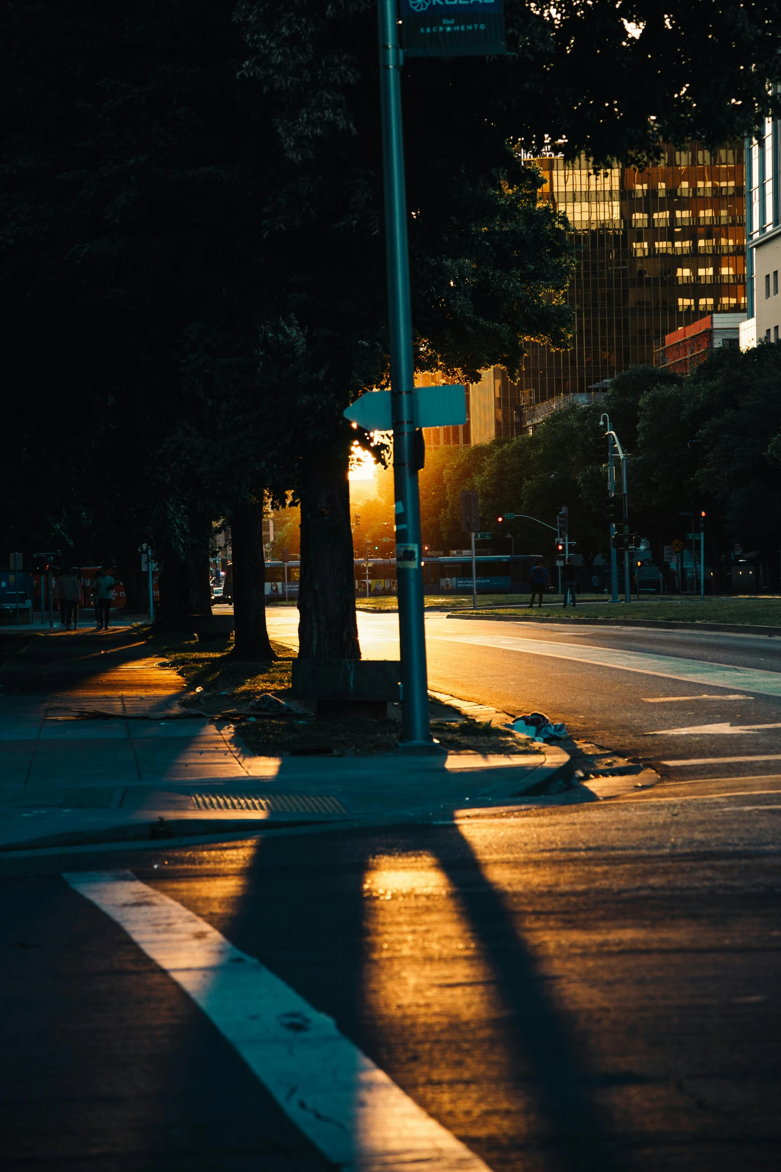 an empty city street is shown at night with no traffic