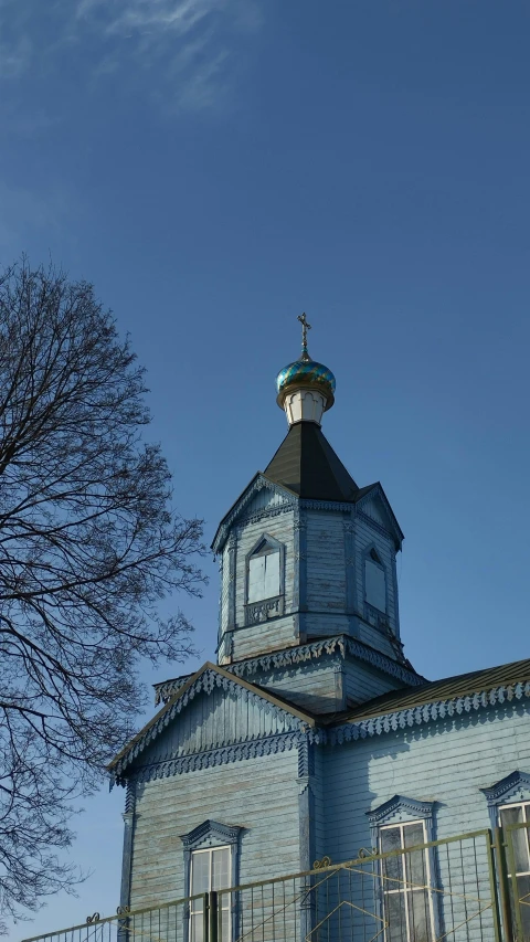 a very old building with a large tower with a small dome and bell