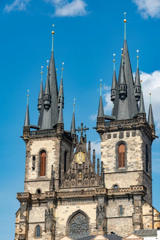 the old building has turrets with gold accents