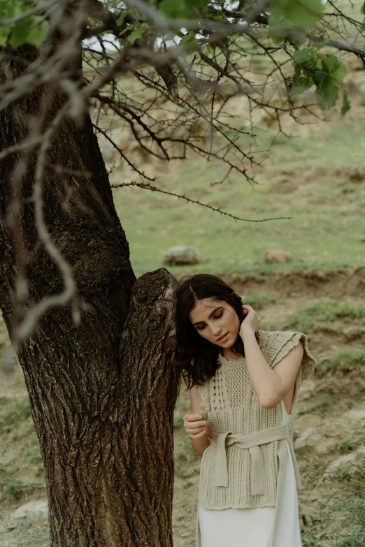 woman posing in the shade under tree