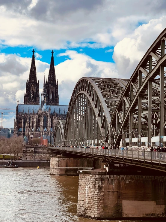 bridge on the river with old churches in the background