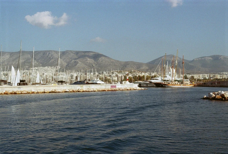 an image of the water surrounding a town with sailboats