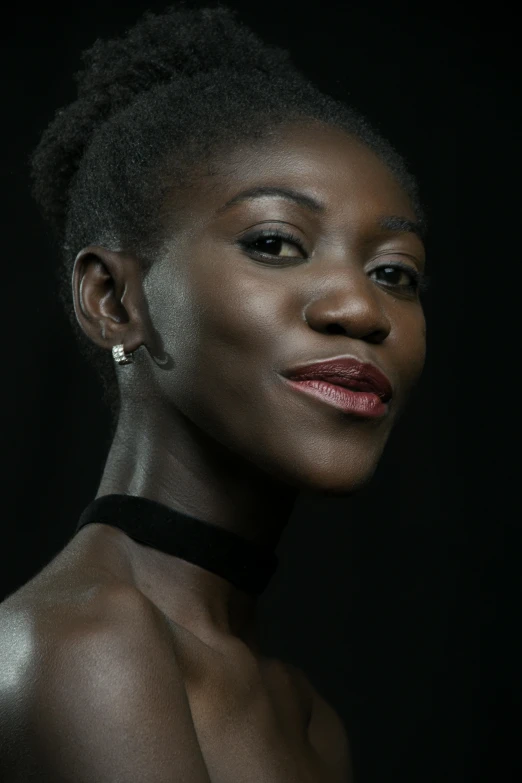 an african american woman wearing ear rings with her eyes closed