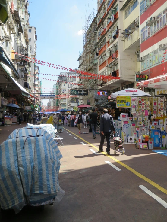 a man with two bags at the sidewalk