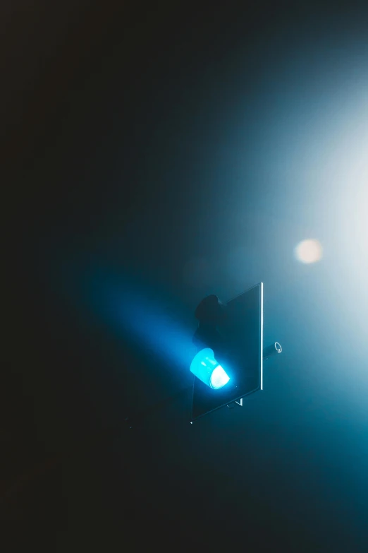 an abstract image of a streetlight lit from within a blue hue