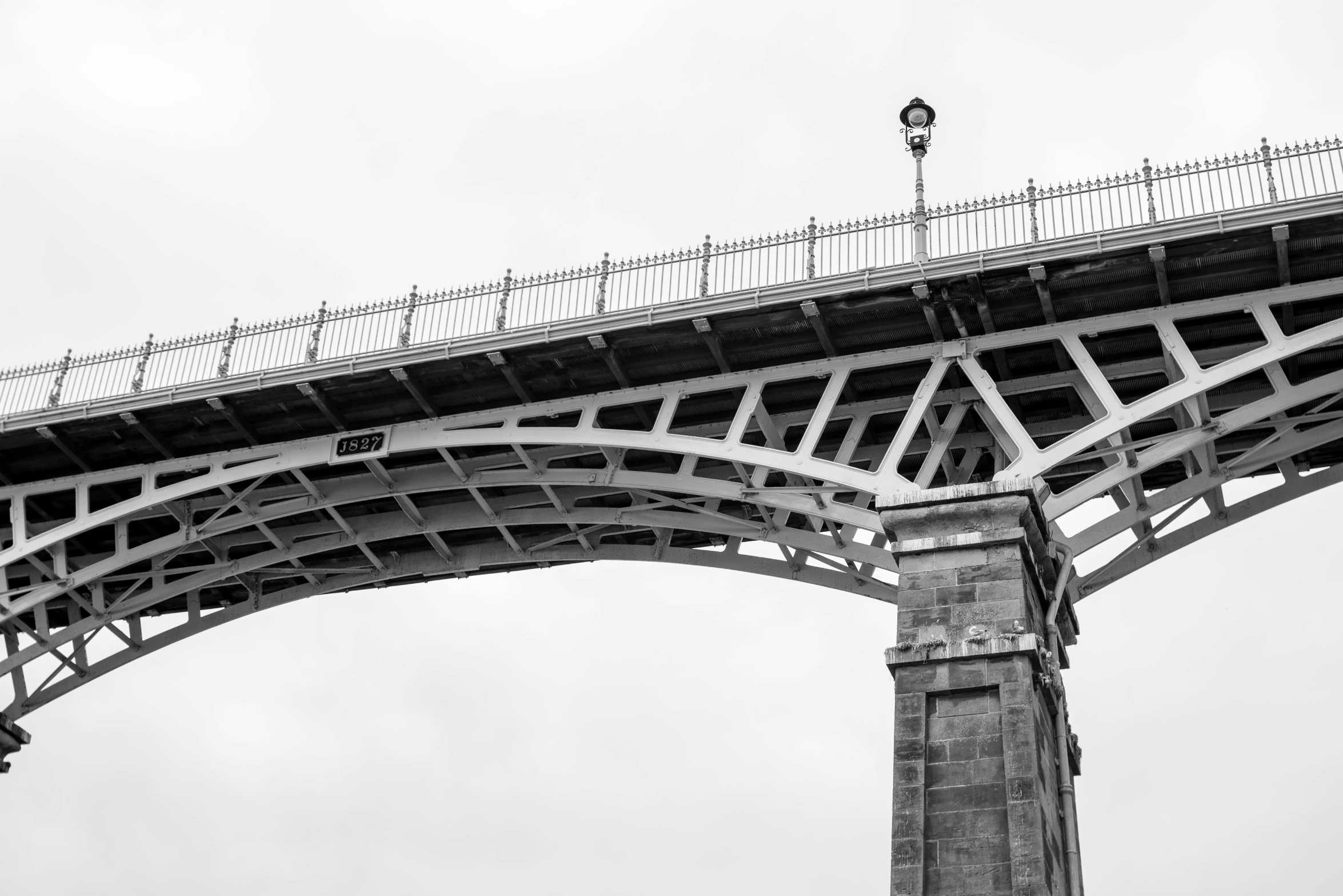 a black and white pograph of a bridge