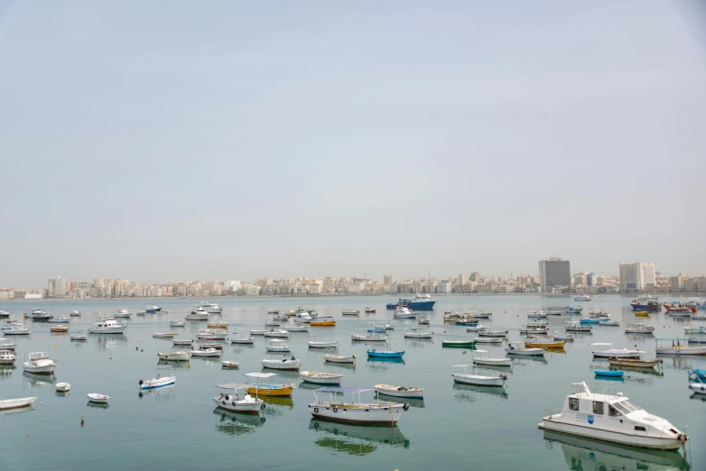 a large open body of water with lots of small boats in it