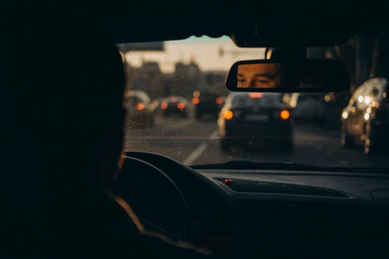 the view of a city street from inside of a vehicle