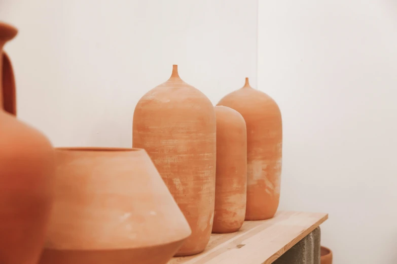 some very pretty clay pots on the shelf