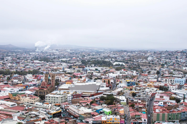 an aerial view of a city in the fog