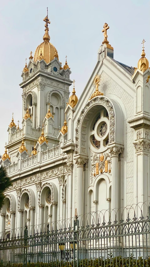 a building with golden crosses and cross windows