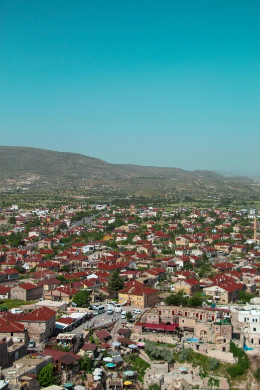 a city view with buildings and mountains in the background