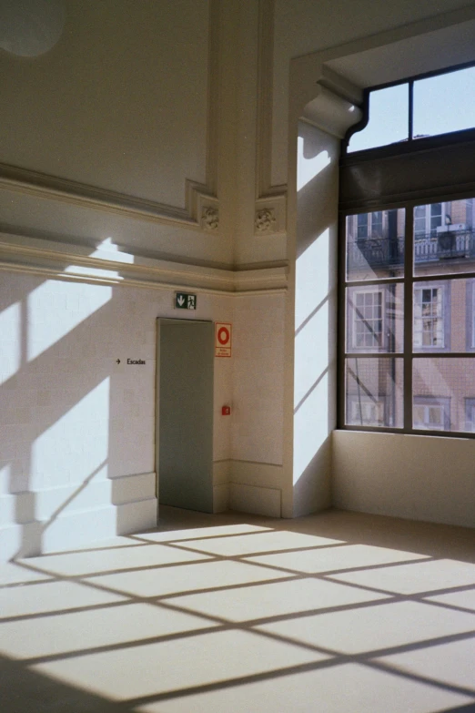 sunlight coming in from large windows on the walls and ceiling