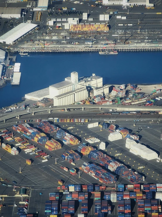 an aerial view of shipping containers in a harbor