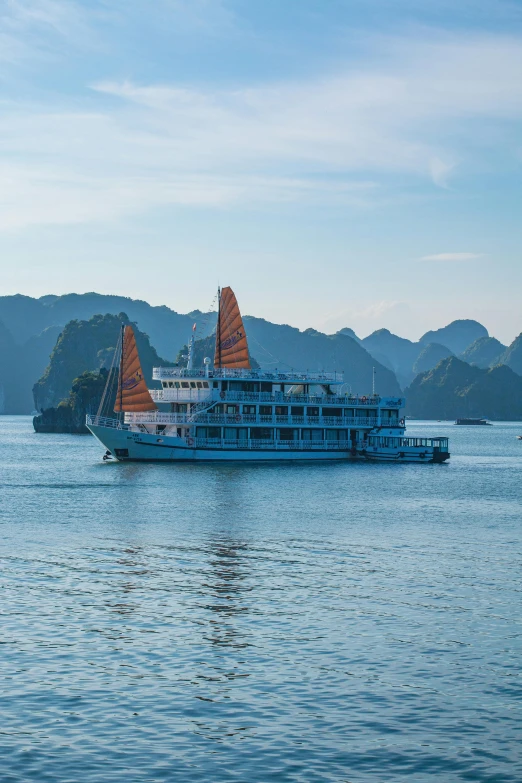 the water is blue and green, with a boat in it