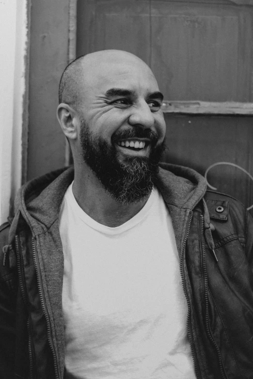 black and white po of a man smiling