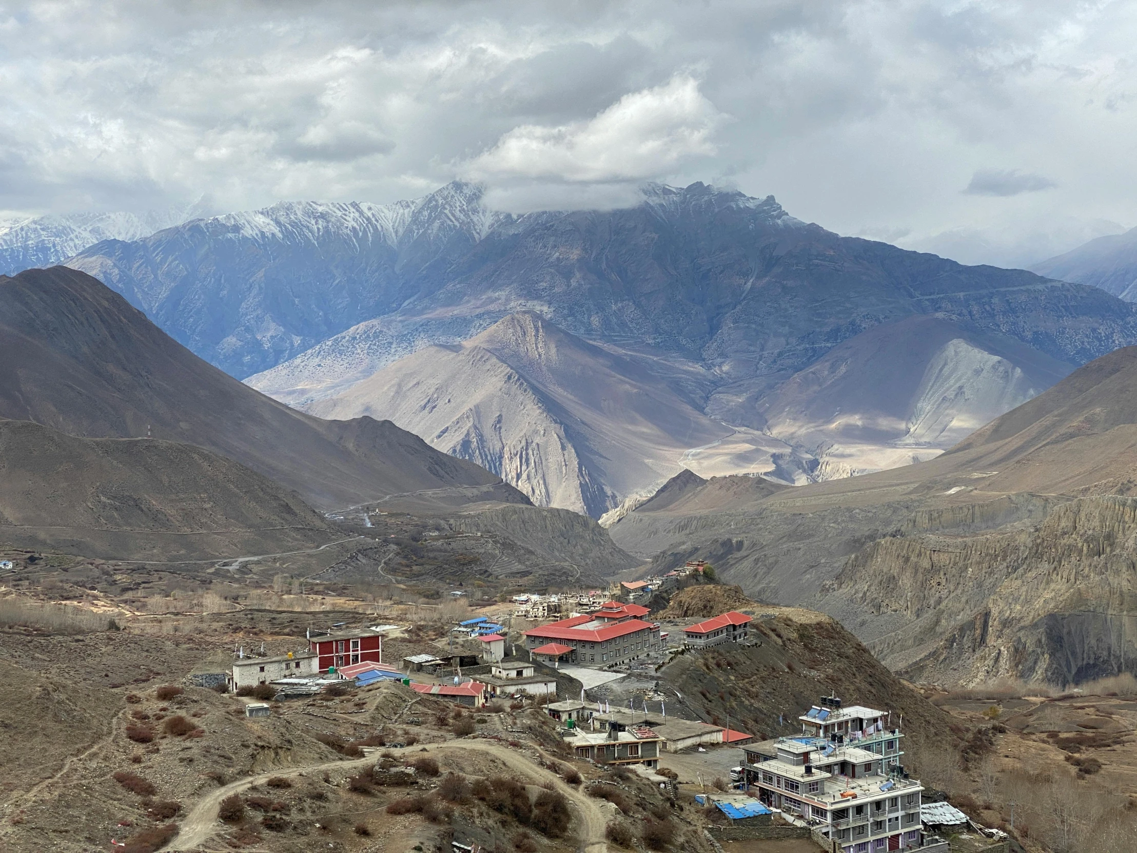 a town is on a mountain next to a valley