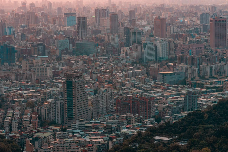 an aerial view of an urban area is seen from the top of a mountain