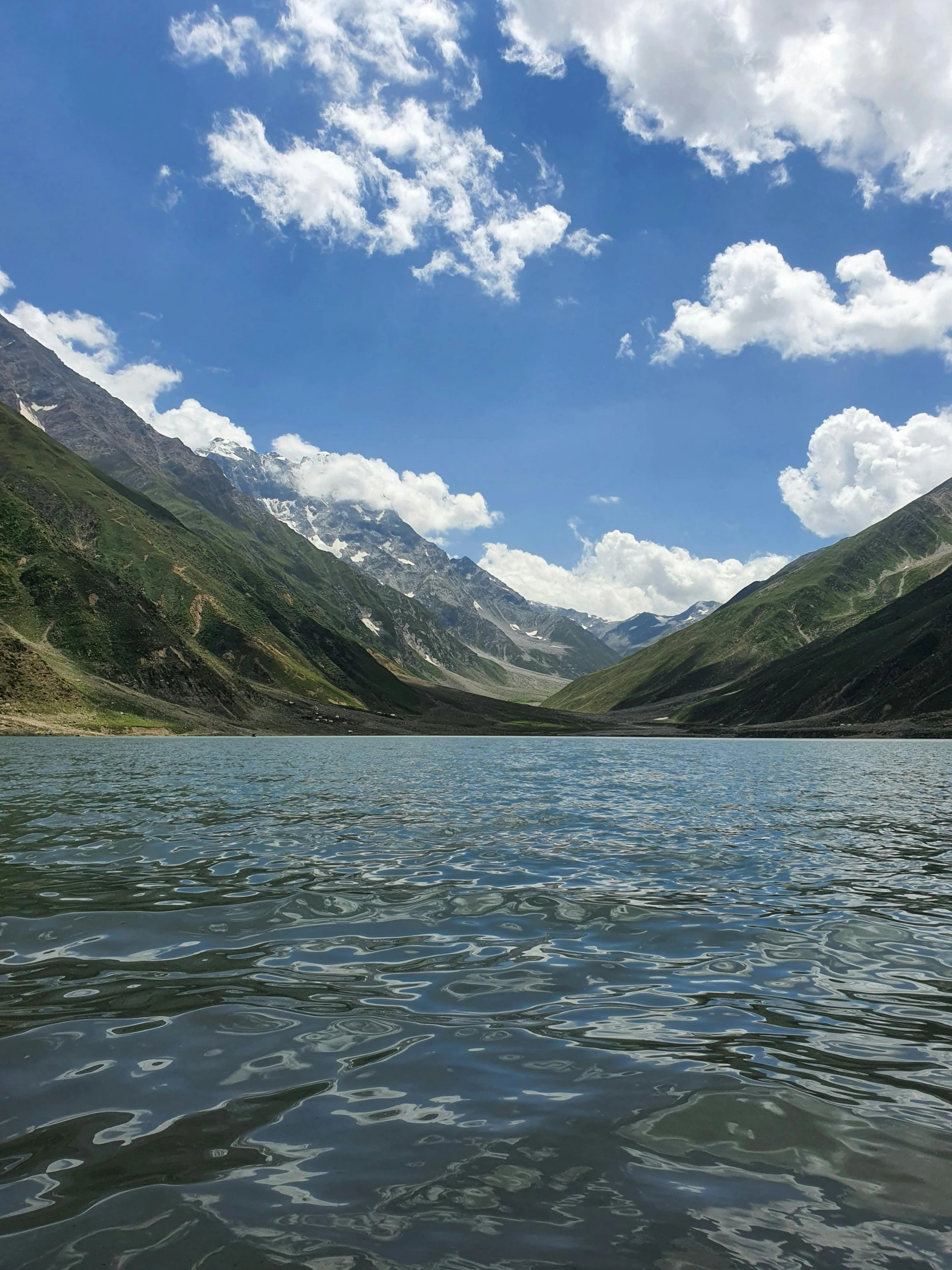 mountains and water under a bright blue sky