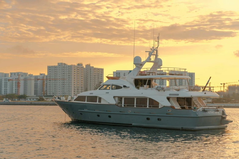 a large boat sits parked in the ocean