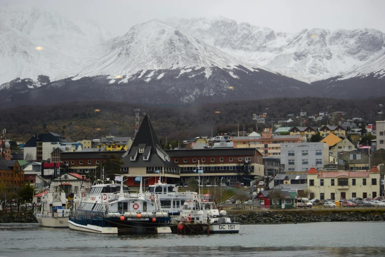 a city view in the winter time with mountains in the distance