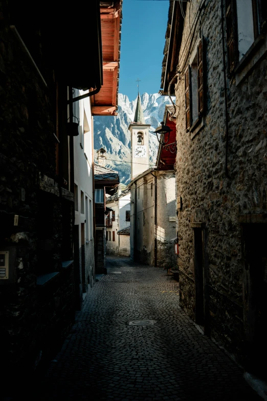 an empty cobblestone street in an old town