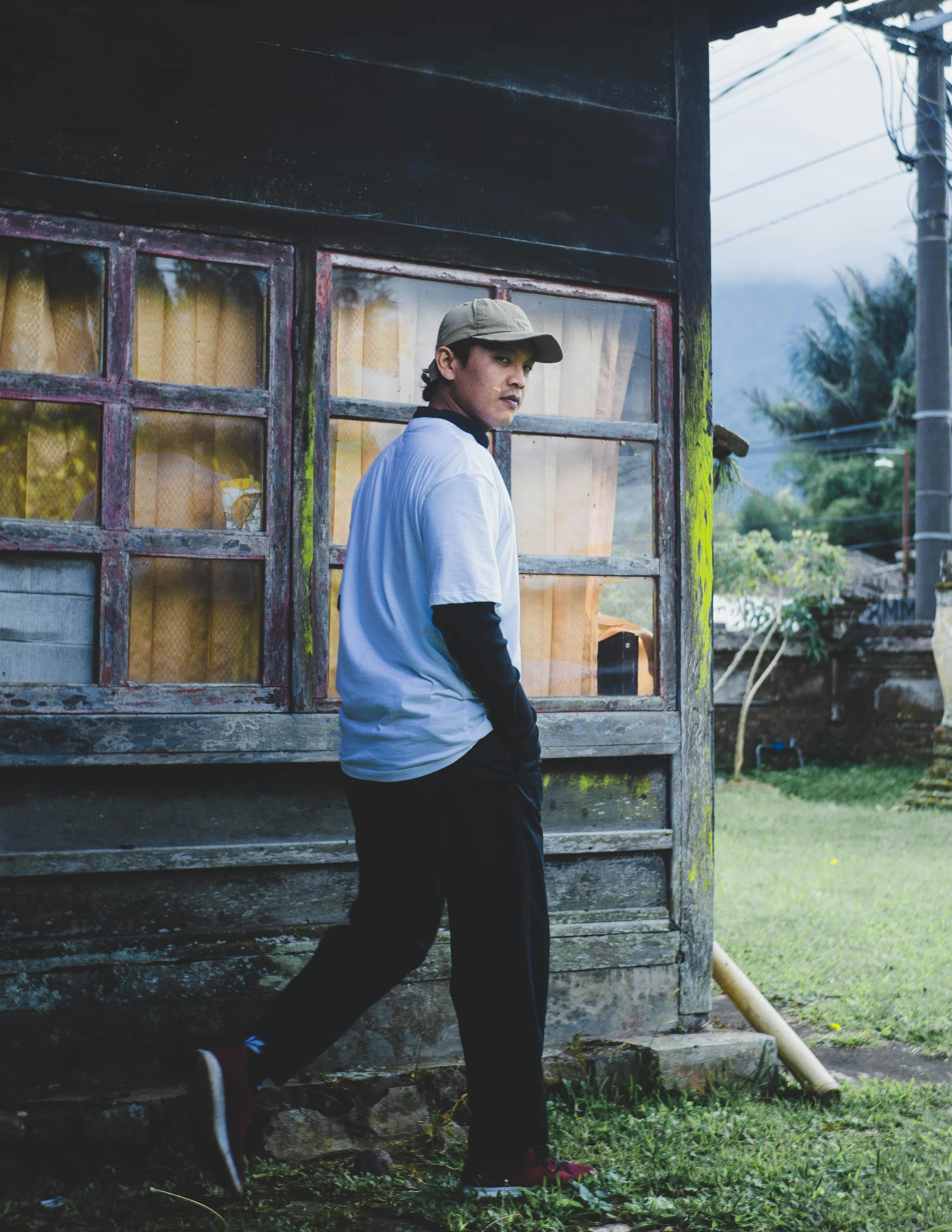 a person with a baseball cap walking towards the camera