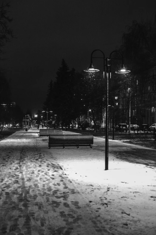 black and white pograph of benches on the ground