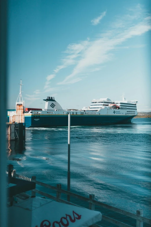 two ferries in the water next to a dock