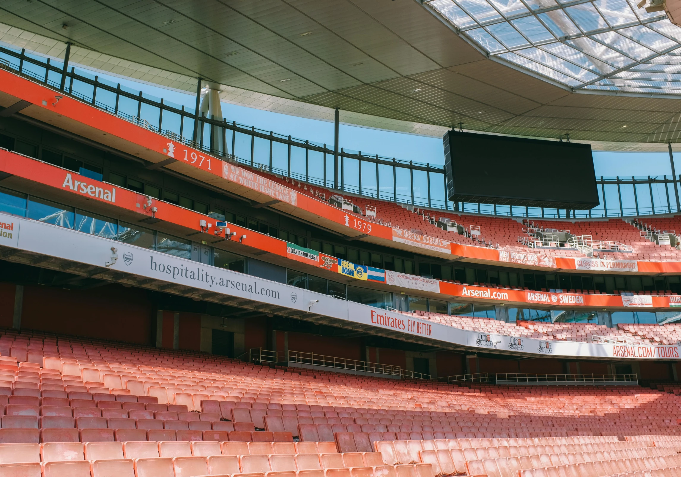 a baseball stadium full of orange and white seats