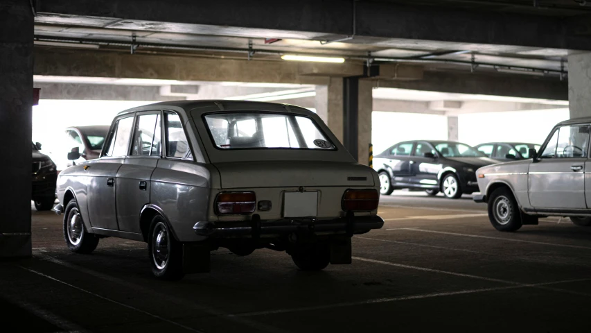 old car parked next to two older ones